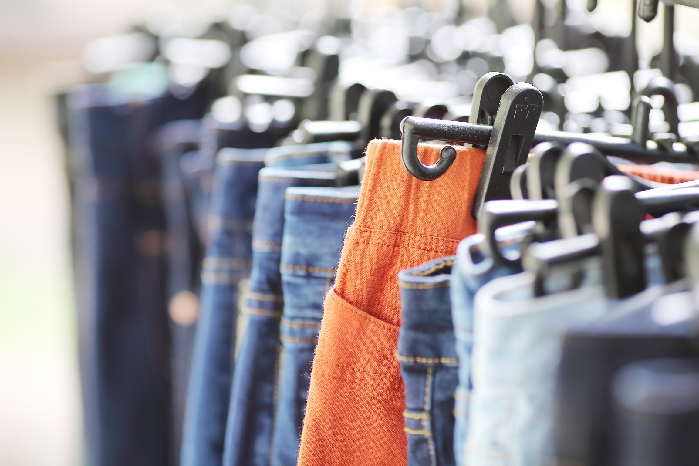 lot of womens jeans at a store